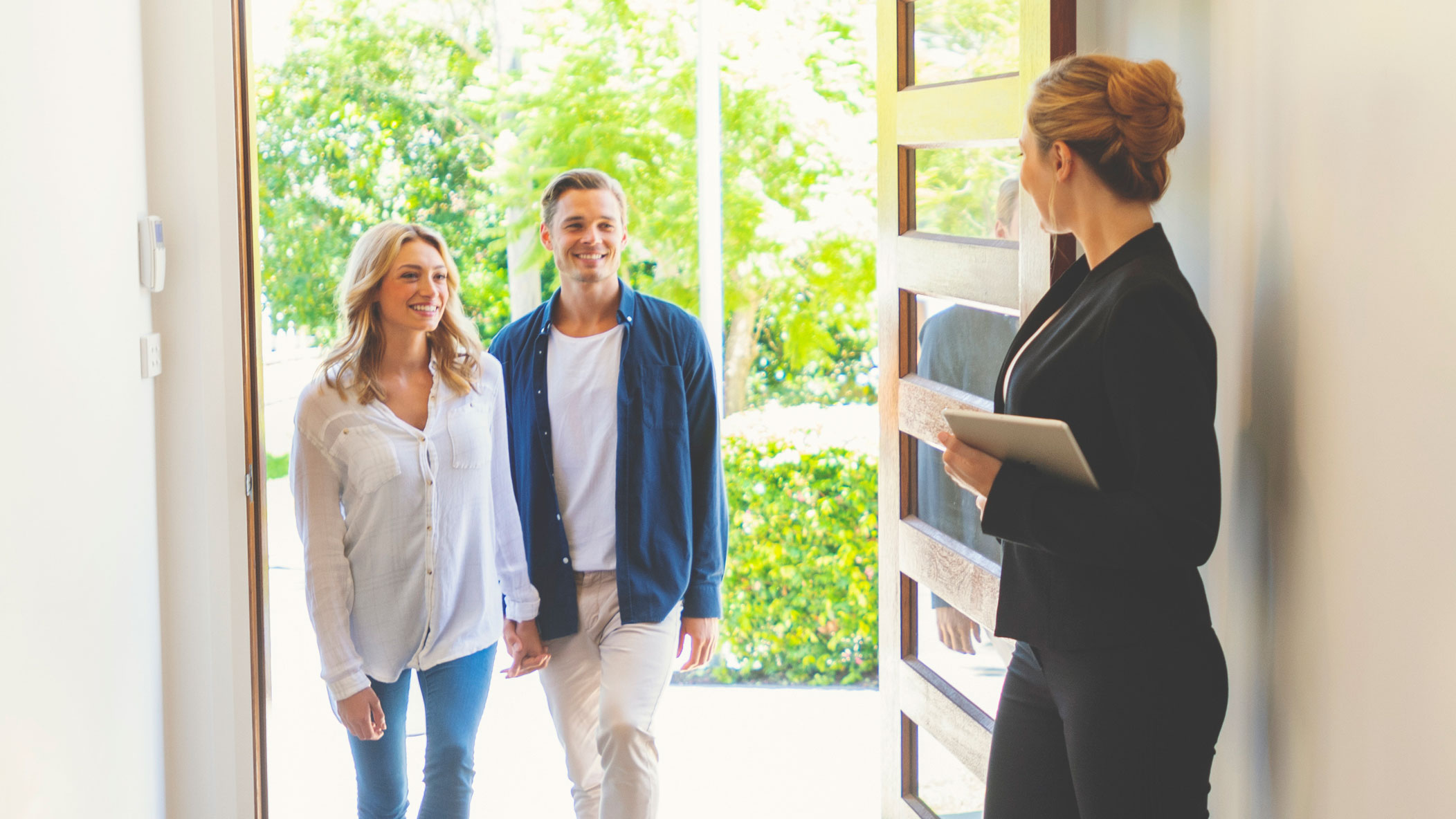 Realtor Showing Couple Modern Home